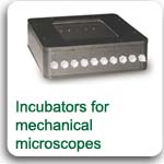 Miniature incubators for microscope stages